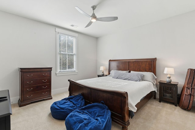 bedroom featuring ceiling fan and light carpet