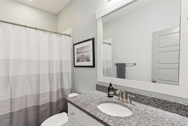 bathroom with toilet and vanity