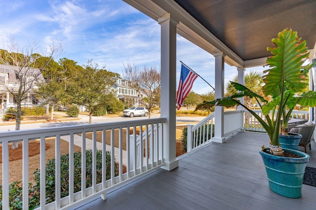 wooden terrace featuring covered porch