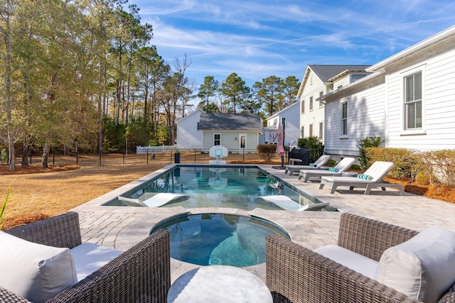 view of pool featuring an in ground hot tub and a patio