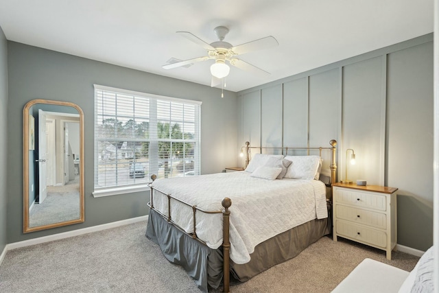 bedroom featuring baseboards, a ceiling fan, and light colored carpet