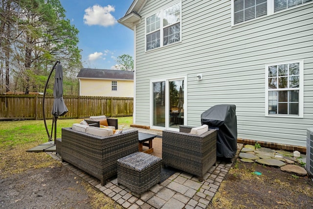 view of patio / terrace featuring a fenced backyard, an outdoor hangout area, and area for grilling