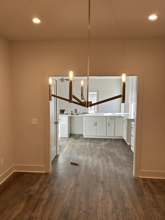 kitchen featuring white cabinets, dark wood finished floors, and recessed lighting