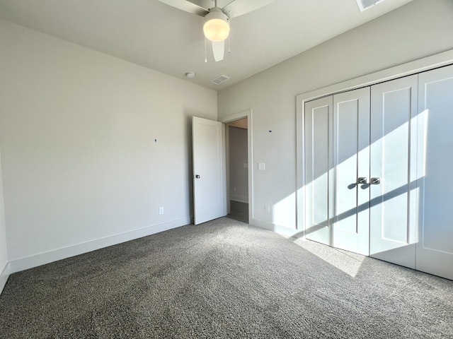 unfurnished bedroom featuring a closet, visible vents, carpet flooring, ceiling fan, and baseboards