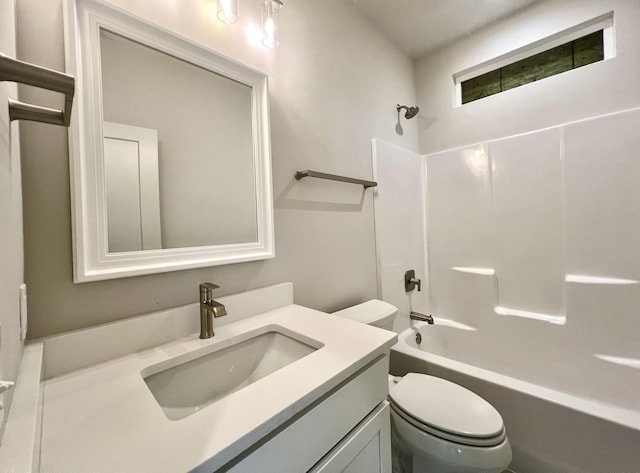 bathroom featuring toilet, shower / tub combination, and vanity