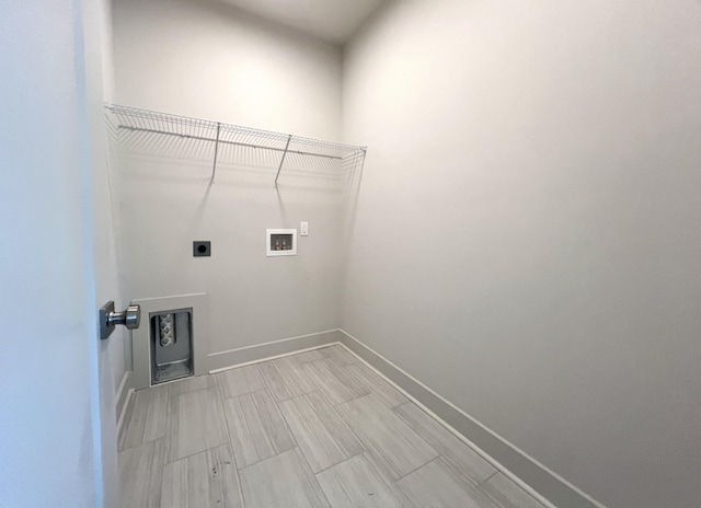 washroom featuring hookup for a washing machine, laundry area, hookup for an electric dryer, and baseboards