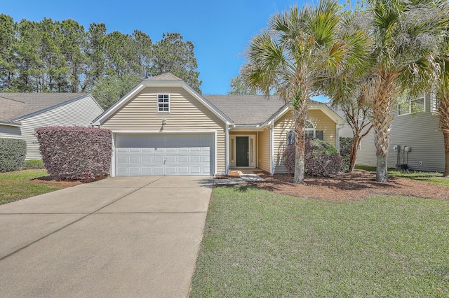 view of front of home with a front yard, driveway, and an attached garage