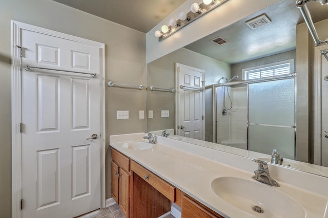 full bathroom with a shower stall, a sink, and visible vents