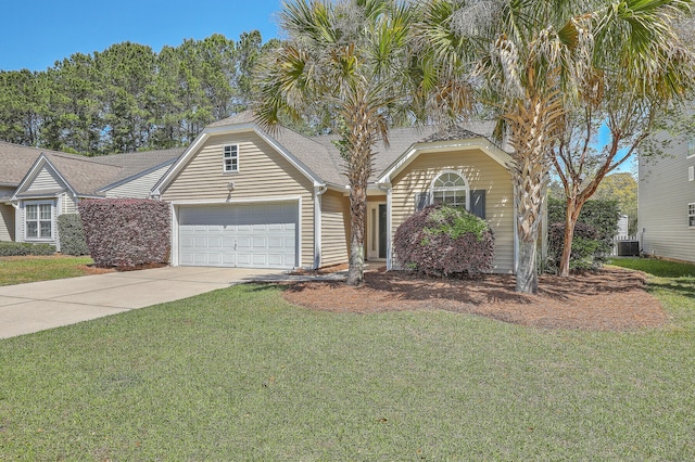 view of front of property with a garage, a front yard, driveway, and central AC