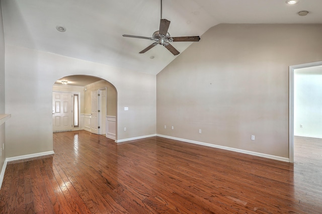 spare room with arched walkways, high vaulted ceiling, ceiling fan, and hardwood / wood-style floors