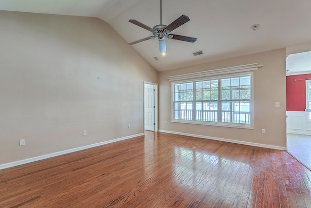 spare room featuring visible vents, a ceiling fan, hardwood / wood-style floors, and a healthy amount of sunlight