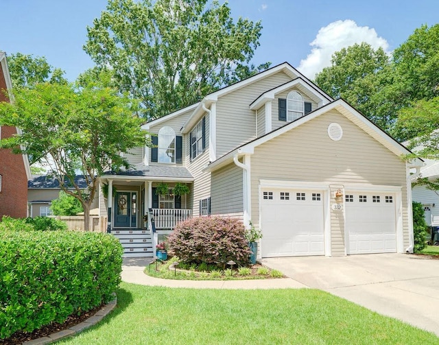 332 Clayton Dr, Charleston, SC 29414 - view of front facade with concrete driveway, covered porch, an attached garage, and a front lawn