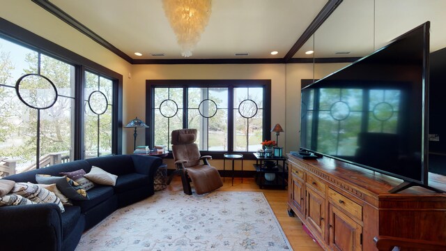 268 Little Oak Island Dr, Folly Beach, SC 29439 - living room featuring light wood-type flooring and a healthy amount of sunlight