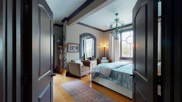 268 Little Oak Island Dr, Folly Beach, SC 29439 - bedroom with light hardwood / wood-style flooring and ornamental molding