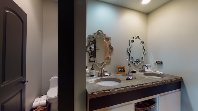 268 Little Oak Island Dr, Folly Beach, SC 29439 - bathroom featuring double vanity and toilet