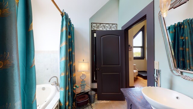268 Little Oak Island Dr, Folly Beach, SC 29439 - bathroom featuring tile patterned flooring, vanity, and a tub to relax in