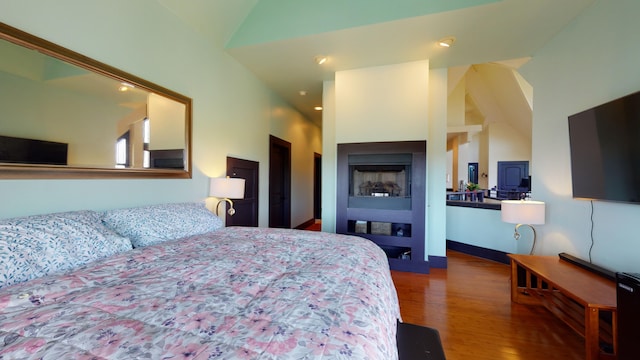 268 Little Oak Island Dr, Folly Beach, SC 29439 - bedroom with high vaulted ceiling and dark wood-type flooring