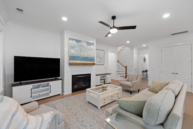 3226 Waverly Ln, Johns Island, SC 29455 - living area featuring stairs, wood finished floors, crown molding, ceiling fan, and recessed lighting