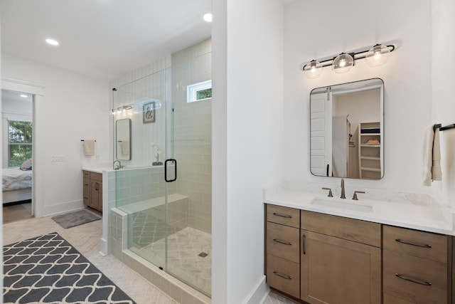 3226 Waverly Ln, Johns Island, SC 29455 - bathroom featuring two vanities, a stall shower, ensuite bathroom, recessed lighting, and a closet