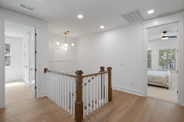 3226 Waverly Ln, Johns Island, SC 29455 - hallway with wood-type flooring, an upstairs landing, plenty of natural light, and recessed lighting