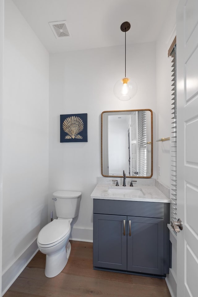 3226 Waverly Ln, Johns Island, SC 29455 - half bathroom featuring vanity and wood finished floors
