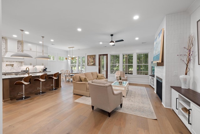 3226 Waverly Ln, Johns Island, SC 29455 - living area featuring light wood finished floors, a fireplace, recessed lighting, and ceiling fan