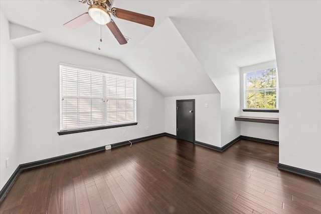 bonus room with vaulted ceiling, ceiling fan, baseboards, and wood finished floors