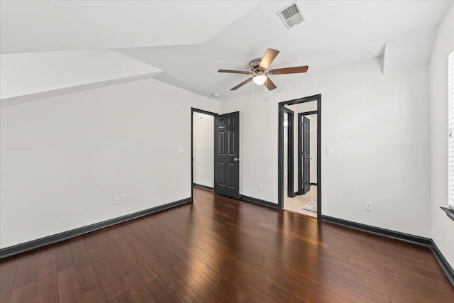 empty room featuring visible vents, wood-type flooring, baseboards, and ceiling fan