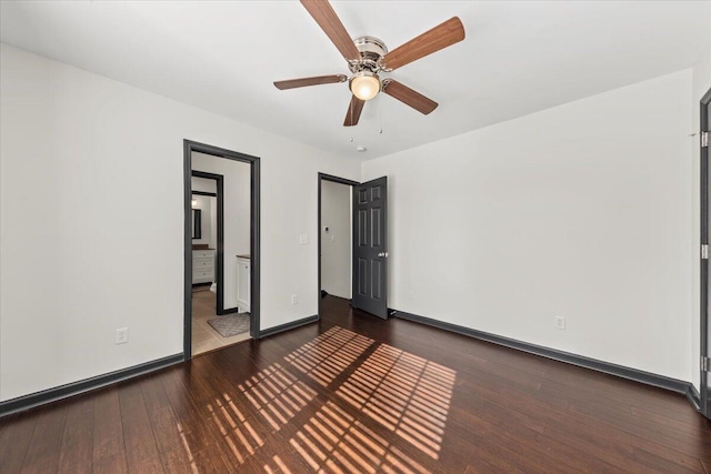 unfurnished bedroom with ceiling fan, baseboards, and hardwood / wood-style floors