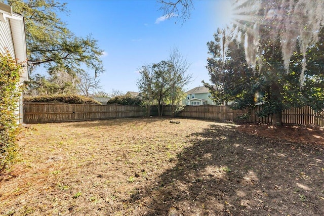 view of yard featuring a fenced backyard