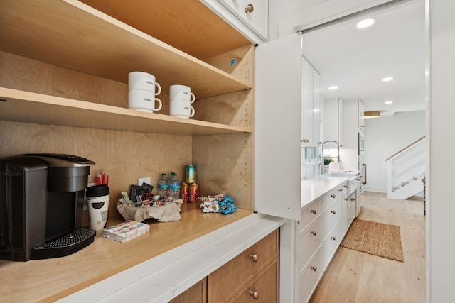 313 E Arctic Ave, Folly Beach, SC 29439 - detailed view of wood finished floors, oven, a sink, and recessed lighting
