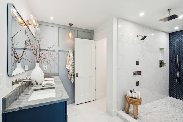 313 E Arctic Ave, Folly Beach, SC 29439 - bathroom with marble finish floors, double vanity, walk in shower, and recessed lighting