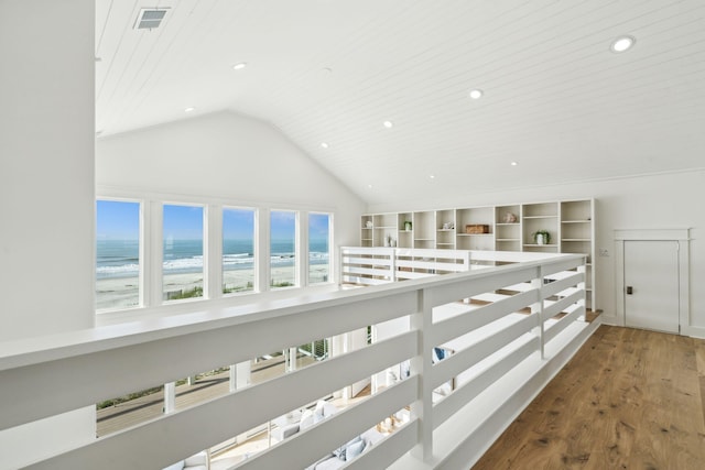 313 E Arctic Ave, Folly Beach, SC 29439 - hall with wood finished floors, high vaulted ceiling, and recessed lighting