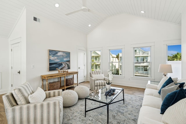 313 E Arctic Ave, Folly Beach, SC 29439 - living room with light wood-type flooring, recessed lighting, ceiling fan, healthy amount of natural light, and high vaulted ceiling