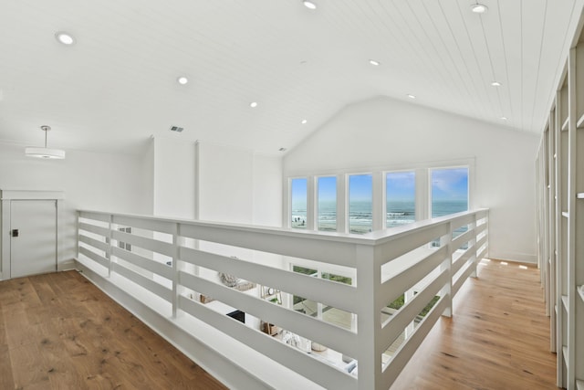 313 E Arctic Ave, Folly Beach, SC 29439 - hallway with recessed lighting, wood finished floors, elevator, a water view, and high vaulted ceiling