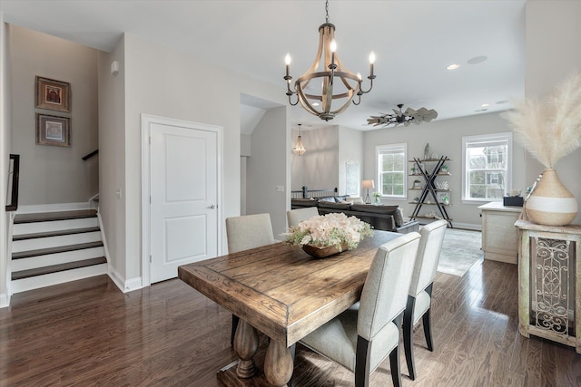 dining room featuring baseboards, dark wood-style floors, stairs, a chandelier, and recessed lighting