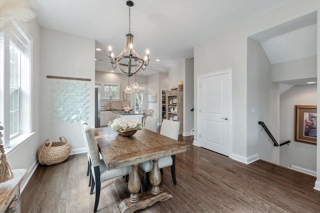 dining area featuring baseboards, a chandelier, dark wood finished floors, and recessed lighting