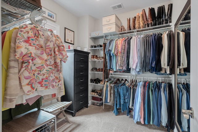 walk in closet with carpet floors and visible vents