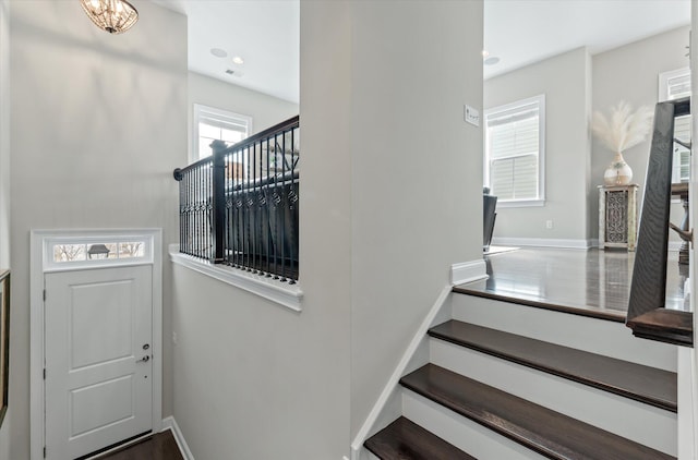 staircase with recessed lighting and baseboards