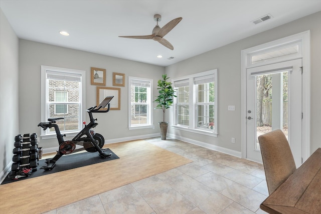 workout room featuring baseboards, visible vents, and recessed lighting