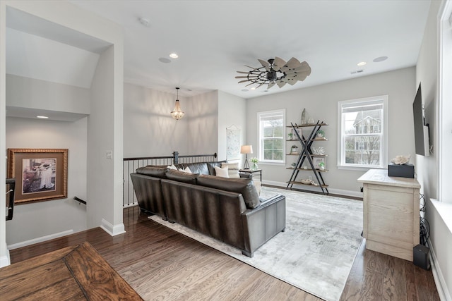 living room with dark wood-type flooring, recessed lighting, a ceiling fan, and baseboards