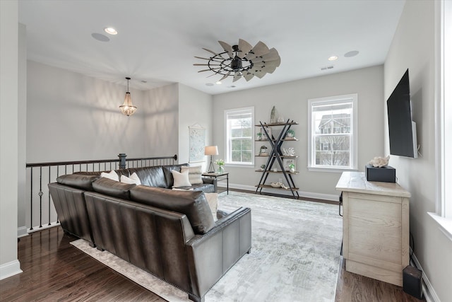 living room with dark wood-style floors, recessed lighting, visible vents, ceiling fan, and baseboards