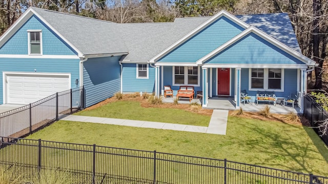 view of front of house with covered porch, concrete driveway, a front yard, and a fenced backyard