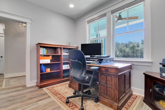 office area with recessed lighting, light wood-style flooring, and baseboards