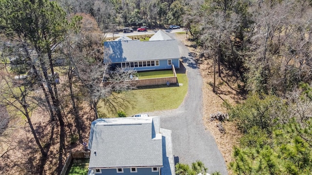 drone / aerial view featuring a forest view