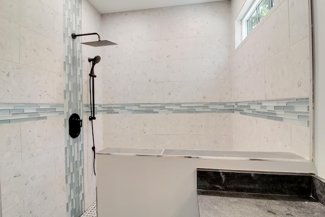 interior details featuring a tile shower