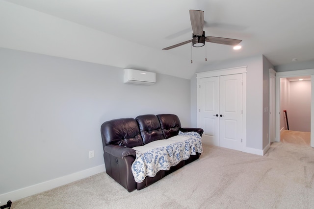 sitting room with carpet, baseboards, a wall mounted air conditioner, and ceiling fan