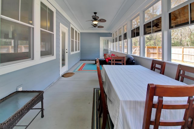 sunroom featuring ceiling fan