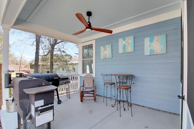 view of patio / terrace with a ceiling fan and grilling area