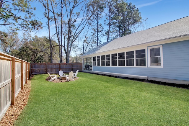 view of yard with an outdoor fire pit and a fenced backyard